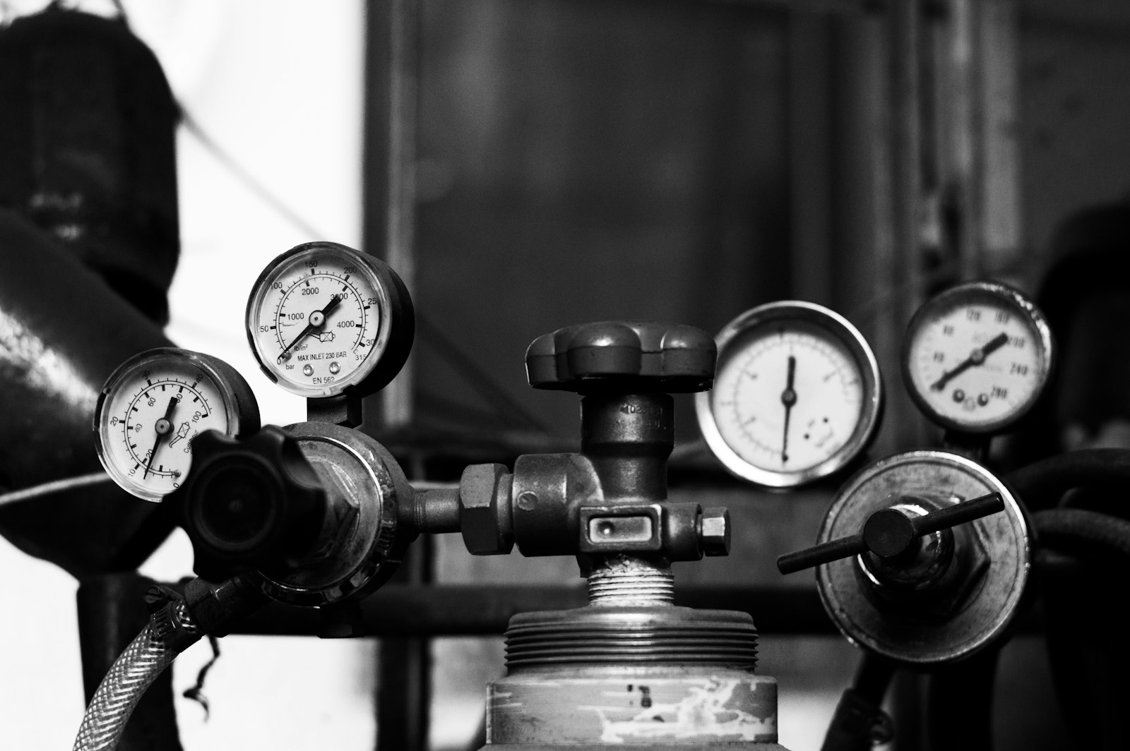 Pressure gauges and a valve are shown.